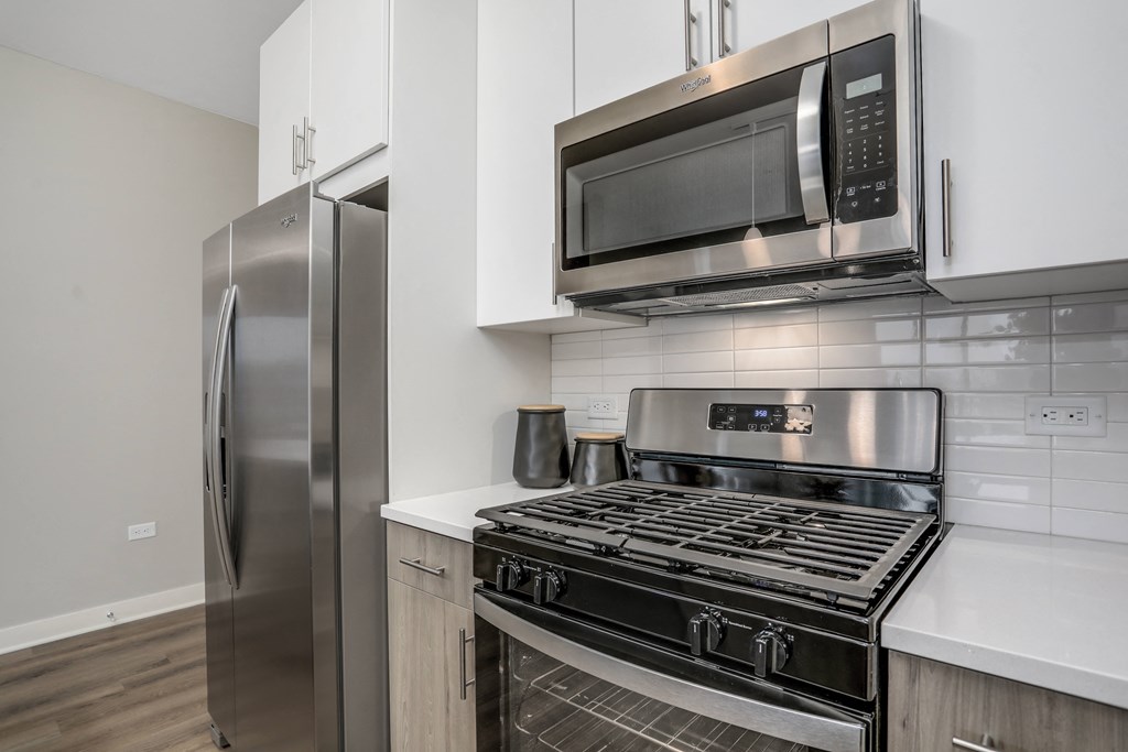 a kitchen with stainless steel appliances and a stainless steel refrigerator a kitchen with stainless steel appliances and a stainless steel refrigerator at Beekman on Broadway, Michigan, 48105